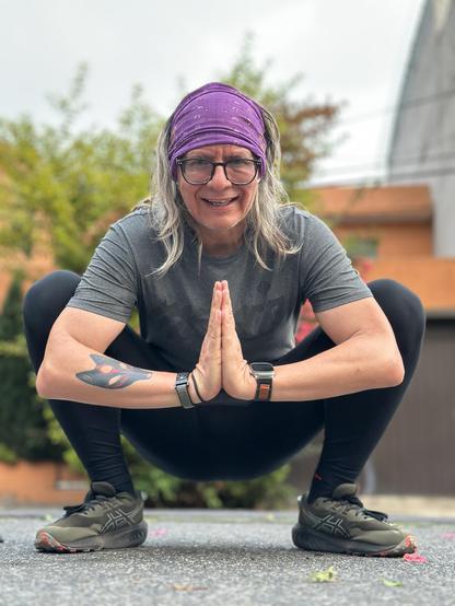 Squatting before the camera for a post workout selfie