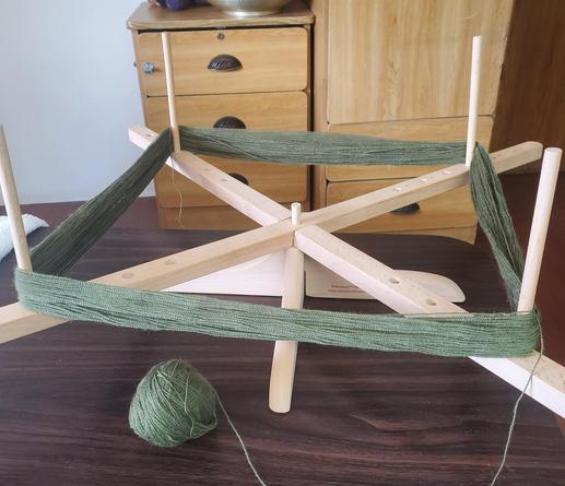 Shibui lace weight Cima being spun into a ball on an Amish swift which I love using