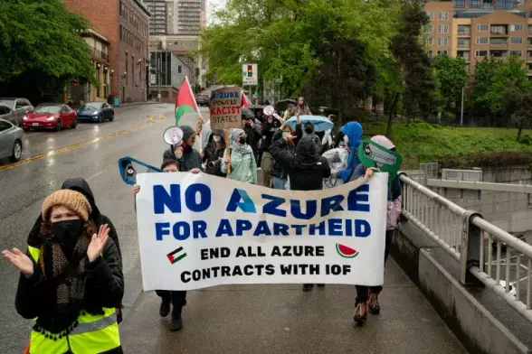 Demonstrators march in support of Palestinians in Gaza near the Microsoft Build conference in Seattle.
The banner reads:
No Azure for apartheid. End all Azure contracts with IDF.