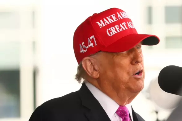 Trump at West Point Military Academy wearing a MAGA cap.