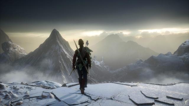 A lone figure stands on a snowy mountain peak, overlooking a vast landscape of distant mountains and valleys. The sky is overcast, with soft light illuminating the scene. The figure is equipped with bows and arrows, dressed in a colorful outfit.