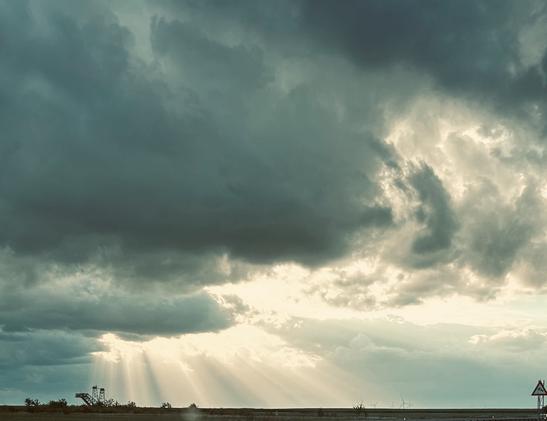 Sun breaking through the dark clouds.