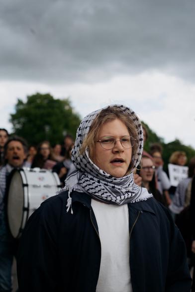 A protester wrapped head in keffiyeh.