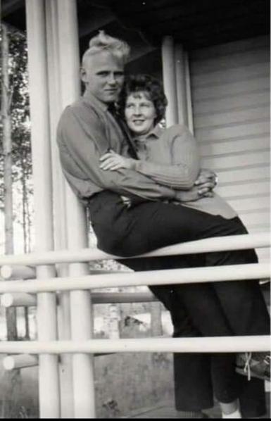 An old black and white photo where my parents are young. My father is holding my mother. My father has a blond hair and my mother dark. The photo is like from an old Finnish movie.