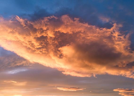 Low evening sun hitting a cloud so fiery it's almost tasteless