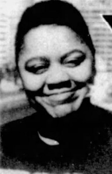 Gwen Hall, from a 1987 newspaper; a smiling Black woman with short hair, photographed in outdoor light
