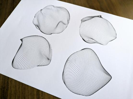 Photo of a sheet of paper with four spherical shapes drawn in black lines. Each sphere is made up of many horizontal lines, and randomly warped to create different line densities.