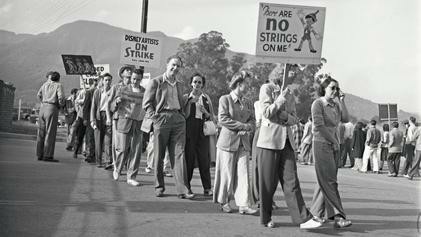 Striking Disney animators picketing at Walt Disney Productions, Burbank, in May 1941. One sign reads: There are no strings on me, with an image of Pinocchio. By Los Angeles Times - https://digital.library.ucla.edu/catalog/ark:/21198/zz0002v3j3, CC BY 4.0, https://commons.wikimedia.org/w/index.php?curid=121428699
