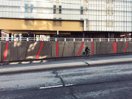 Someone on a bike is climbing a slightly hilly street in Montreal.
