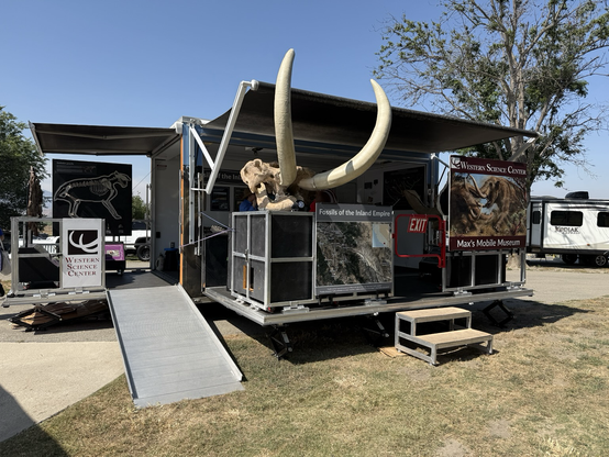Mobile Museum trailer with the skull of Max Mastodon front and center. Max appears to be blowing bubbles.