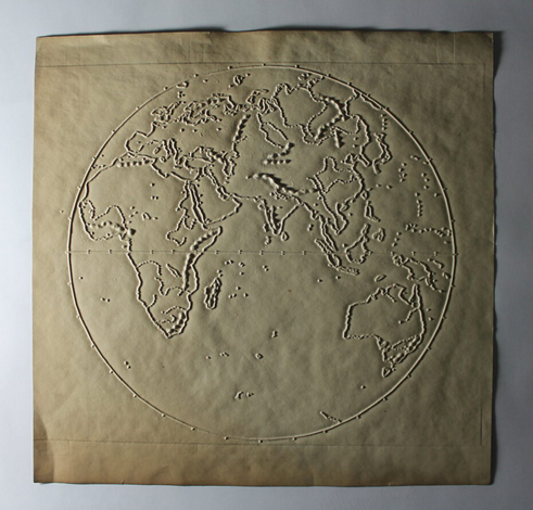A raised picture on thick paper of the globe