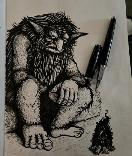 A troll sits on a log by the fire