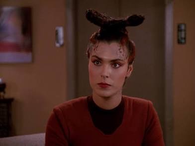 Michelle Forbes playing the daughter of an alien who practices suicide after reaching a certain age.