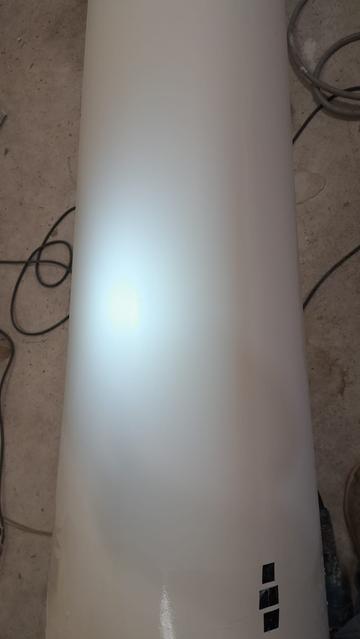 Low angle light shows a uniform surface with no small-scale orange peel, or larger scale waviness or ripples. This is a good sign.