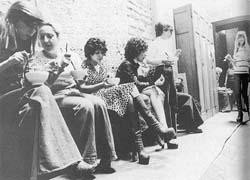 Several sex workers seated inside the church.