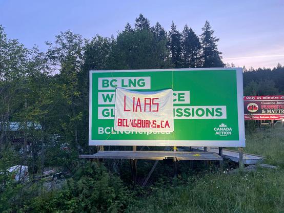 A historical photo from around this time last year when I hoisted a large white tarp that said “LIARS - BCLNGBURNS.CA” overtop the large green billboard from Canada Action