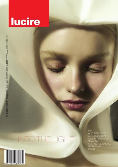 Cover shows a female model wearing a white wedding hood by Dimitra Antonea. The main cover line is 'Into the light'.