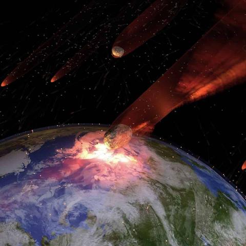 Artist's rendering of a massive asteroid impact on Earth. The image shows Earth from space with continents and oceans visible, as a large rocky asteroid strikes the planet's surface, creating a bright explosion with orange and white light. Multiple smaller asteroids are visible in the background against the black of space, with red-orange trails or atmospheric effects streaking across the scene.