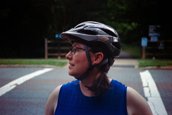 The spousal unit wearing bike helmet, looking to the side