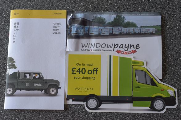 The photograph shows the three items of marketing materials described in the text of this post.