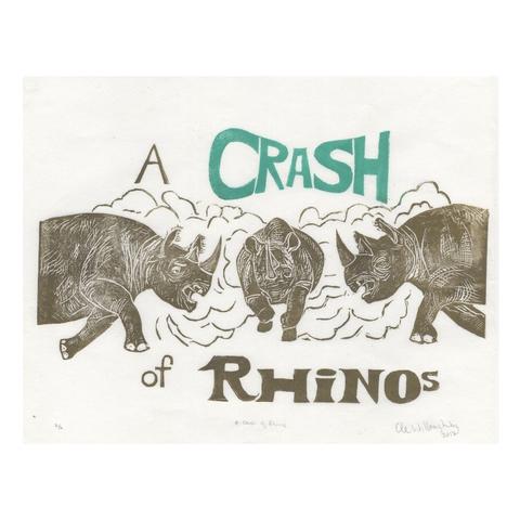 My linocut print shows three beige rhinos charging toward one another; the front of a rhino running right from the left, the front of another running left from right side and one in the middle going forward amongst a cloud of dust. Above there is a gold ‘A’ and turquoise ‘CRASH’ and below in black there are the words ‘of RHINOS.’