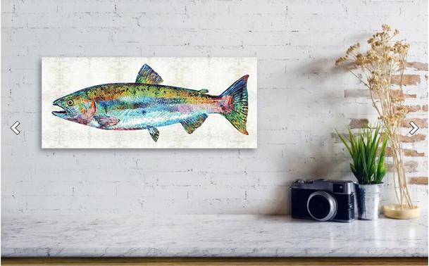 Colorful salmon collage painting on a cream patterned background in a furniture setting.  Art by Sharon Cummings.