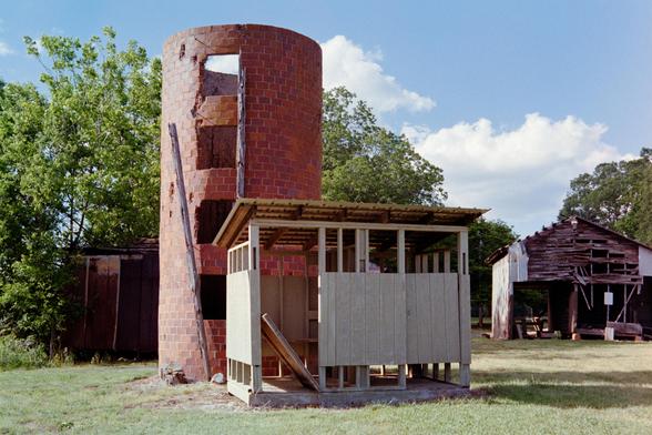 A brick silo, missing its lid and next to some sort of small shack - maybe a latrine?  A weathered and falling apart barn is in the background 

Nikon FM3A | Nikon 28-105 | Kodak Gold 200 200

Home developed in Cinestill C-41 Stock