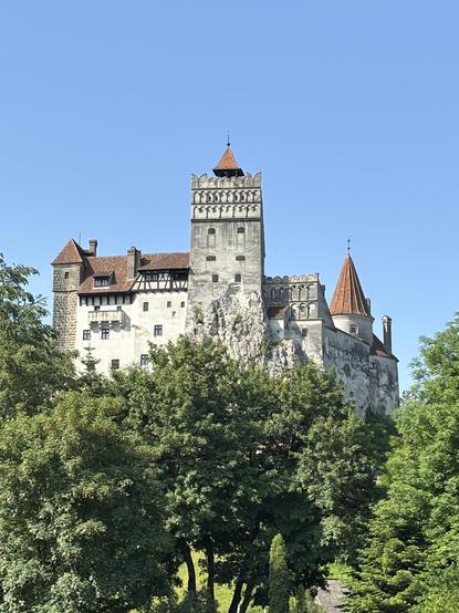 Bran Castle, perched in a dominant and sinister way above the town of Bran.