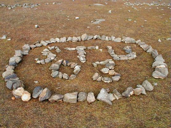 Initials and the year 2003 made in small stones.