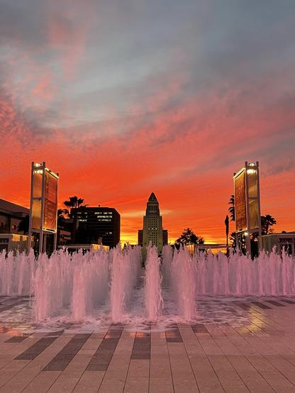 Sunrise view of Los Angeles.  Fountains up in foreground.  My photo