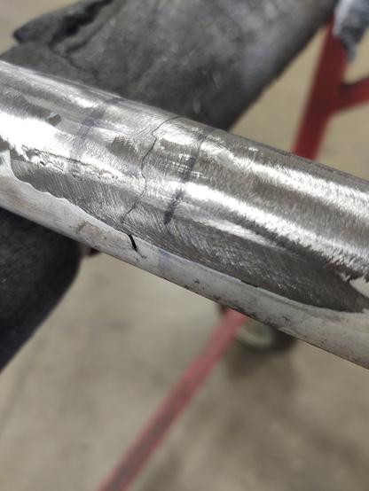 A cracked frame tube, shined up and ready for repair.