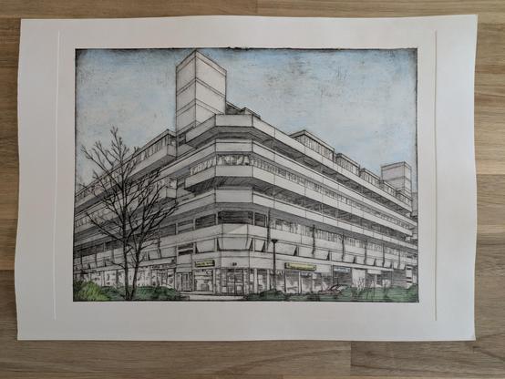 An intaglio print of a large concrete building that has been shaded and coloured with watercolour paint.