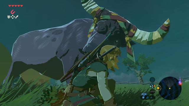 BOTW screenshot, it's getting dark and a large cow is snuggling me.