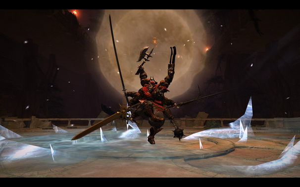 A formidable, multi-armed warrior stands in a dimly lit fantasy arena, holding a variety of weapons including a sword, axe, and mace. The ground is cracked and partly covered with shattered ice. Behind the warrior is a hazy light source, enhancing the scene with an ethereal glow. Torches flicker in the background.