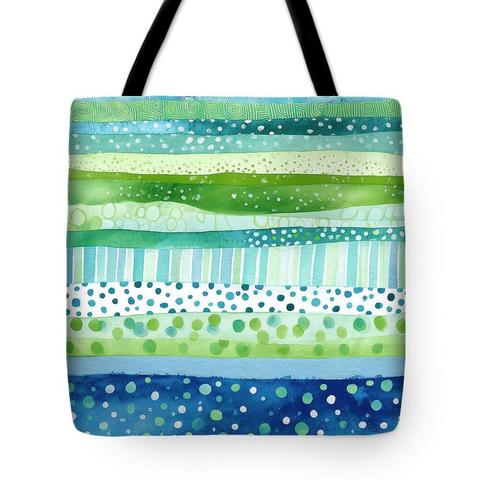 A design print showcased on a tote bag. Abstract artwork with horizontal stripes in blues and greens, accented by playful dots and textured lines, creating a vibrant, rhythmic, and calming visual effect. Art by Lisa S Baker.