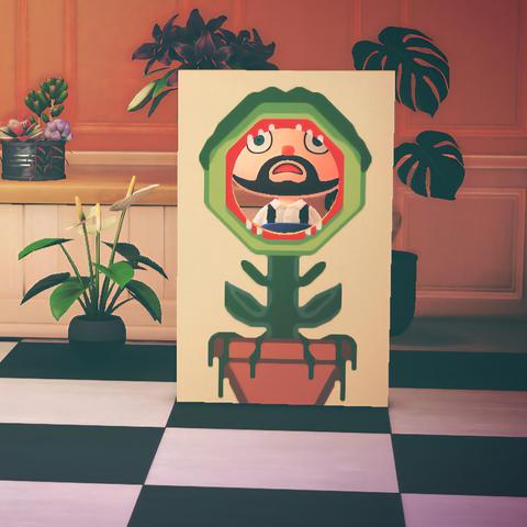 Animal Crossing: New Horizon screenshot stacked vertically. The image is square showing a flower shop with orange walls and a white counter. On and around the counter are assorted plants. Central to the image is a face-cutout standee with an image of a carnivorous plant with a red mouth open and little white teeth that is sitting in a large pot. Inside the opening of the standee, a light skinned, bearded human can be seen looking shocked as though they were consumed by the plant.