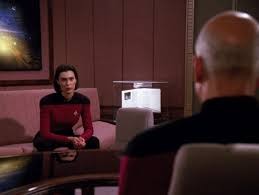 Ro sitting in Picard’s ready room and he talks to her