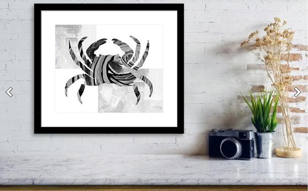 Black and white painted blue crab with gray and white elements in a decor setting by artist Sharon Cummings.