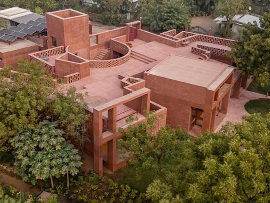 an aerial view of a contemporary brick home