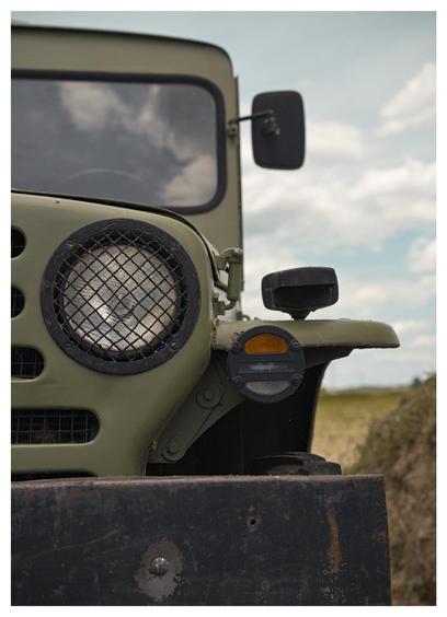 A closeup of the front of a military vehicle, probably a Fiat Campagnola or Zastava AR55