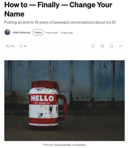 Screenshot of a story by Hilde Festerling with title “How to — Finally — Change Your Name” and a photo of a dirt-splattered red-and-white mug with the words “HELLO MY NAME IS” sitting on the ground