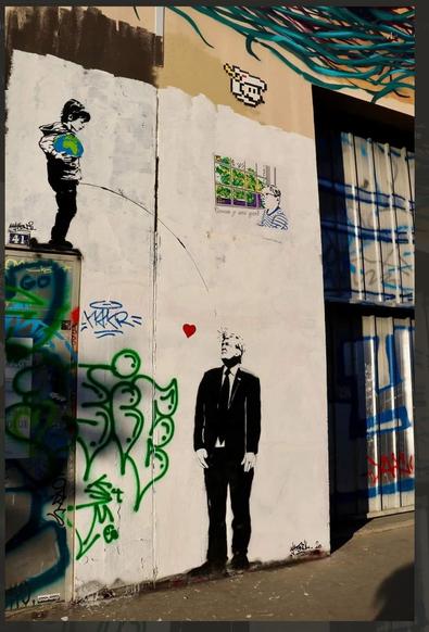 Colour photo of a Banksy style street art showing a young boy holding a globe and standing on a tall box (2 metre) a pissing on donald trump