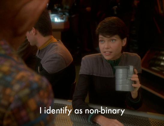 Star Trek Deep Space Nine screencap of Ezri Dax sitting in Quark's Bar. Caption reads "I identify as non-binary"