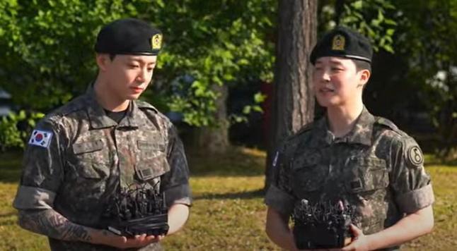 Jungkook and Jimin of BTS delivering short speeches at their discharge ceremony.
