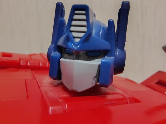A close-up shot of Studio Series Optimus Prime, focused on his head