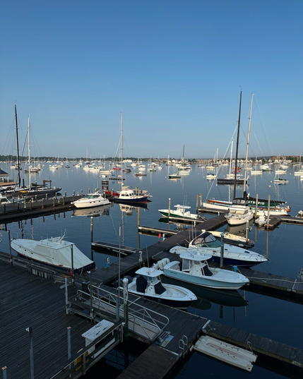 Boats in the harbor with early morning sunshine