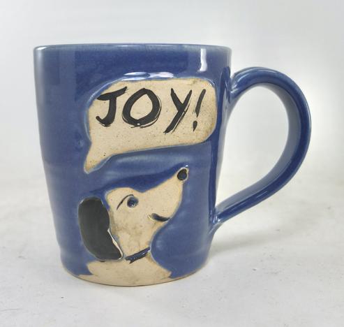 handmade mug with dog on the side and speech bubble saying JOY