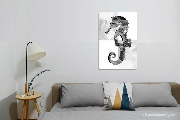 Black and white seahorse painting on white with gray blocks in a bedroom setting by artist Sharon Cummings.