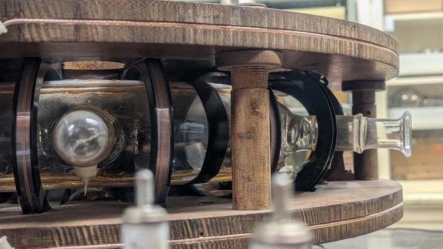 A betatron for making fast electrons. A glass tube in magnets