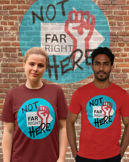 two models wearing a t shirt that has a white arrow with far right printed on it, then over the top are a spraypainted raised fist in red, and 'Not Here' spraypainted. it's also on the wall behind them.